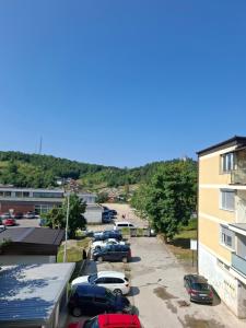 a group of cars parked in a parking lot at Apartman National 2 in Velika Kladuša