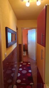 a room with a hallway with a door and a rug at Apartman National 2 in Velika Kladuša