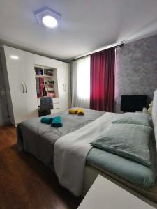a bedroom with a large bed and a window at biker s home in Nabakhtevi