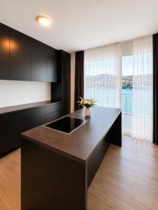 a kitchen with a large island in the middle at Maria Blick in Maria Wörth