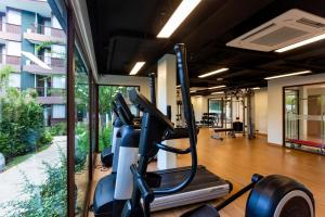 a fitness room with a gym with a treadmill at Wing 4203 - Modern Resort Studio Koh Samui in Bophut