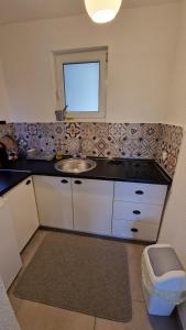 a bathroom with a sink and a window at Apartment Fortuna in Visoko +37 photos