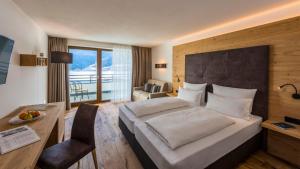 Posteľ alebo postele v izbe v ubytovaní Eden Boutique Hotel