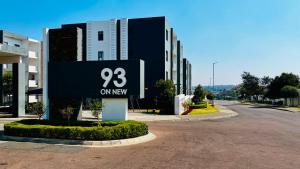 a building with a sign that says oxygen at The One Wave - 2 Bed Serenity meets Luxury in Midrand
