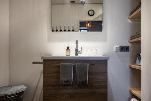 a bathroom with a sink and a mirror at Appartement B&B In de Gulde Steur in Deventer +21 photos