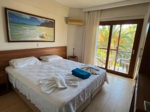 a bedroom with a bed with towels on it at Crescent Hasirci Hotel in Dalyan +40 photos