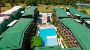 an overhead view of a row of buildings with a pool at Wing 4206 - Modern Resort Studio Koh Samui in Bophut