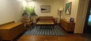 a living room with a couch and a table at Casa Mezcaleria formerly Boracay Beach Club in Boracay