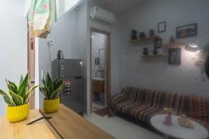 a living room with a couch and a table at LalaHouse Pasteur in Ho Chi Minh City