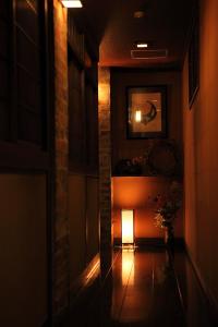 a hallway with a light at the end of a room at Ryokan Yamanoyu in Minamioguni