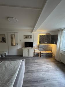 a living room with a bed and a table at Ferienwohnung bei Karl in Schmallenberg