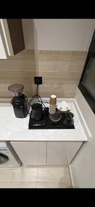 a counter top with a table with some food on it at Elite Stay in Buraydah