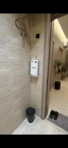 a room with a wall with a box on the wall at Elite Stay in Buraydah