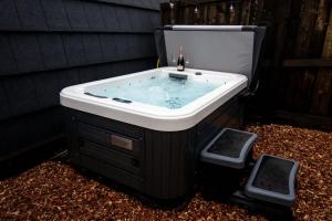 a bath tub with a sink in a yard at The Fox at Snowhill Glamping in Scorton