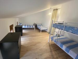 a room with two bunk beds and a desk at Casa Rural Boni in Fuentemolinos