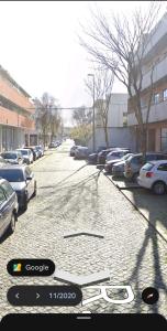 a view of a parking lot with cars parked at Vivas House in Esposende
