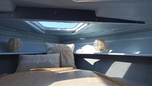 a room with a bed and two lights on the ceiling at Petit Shetland in Liverdun +2 photos