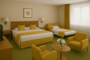a hotel room with two beds and a tv at Resort Klewinowo in Klewinowo +33 photos
