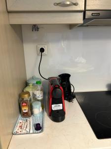 a kitchen counter with a blender and other food items at Sunset View Maisonette, Kanali in Néa Thésis