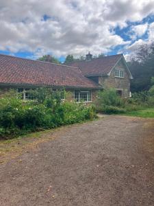 a large brick house with a driveway in front of it at Thorn Tree Garth in Coulton
