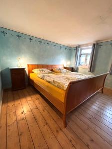 a bedroom with a bed with stars on the wall at Weiherhof in Ehrenberg