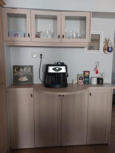 a kitchen counter with a microwave on top of it at Σπίτι σε μοναδική τοποθεσία in Líthion +24 photos