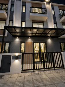 a facade of a building with a balcony at VSIP Executive Living in Hòa Lợi (1)