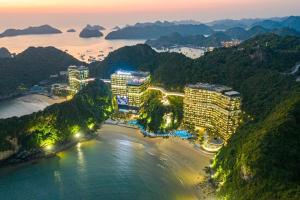 a view of a city with a beach and buildings at Flamingos Cat Ba pre núi in Cat Ba