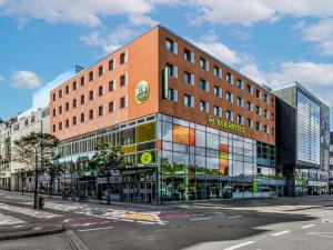 a large building on a city street with at B&B HOTEL Flensburg-City in Flensburg
