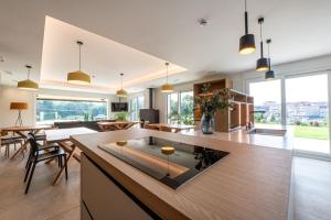a kitchen and living room with a table and chairs at Hotel Gamongoa in Rentería