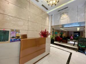 a lobby of a hotel with a counter and a waiting room at Ngan Ha Hotel - Ben Thanh Central in Ho Chi Minh City