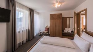 Posteľ alebo postele v izbe v ubytovaní Eden Boutique Hotel