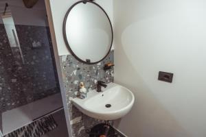 a bathroom with a sink and a mirror at Tenuta del Picchio in Colombara +11 photos