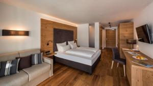 Posteľ alebo postele v izbe v ubytovaní Eden Boutique Hotel