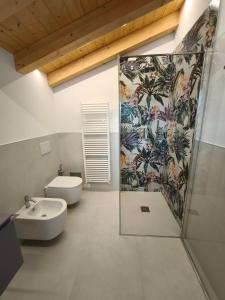 a bathroom with a toilet and a sink and a shower at L'Albero del Tempo in Falze