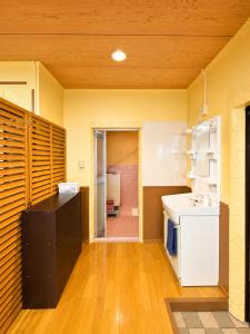 a kitchen with a sink and a dishwasher at Local LifeYOMITAN in Yomitan +26 photos