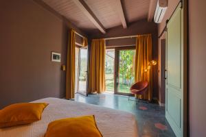 a bedroom with a bed and a large window at VILLA SUMAC 6, Emma Villas in Sortino +57 photos