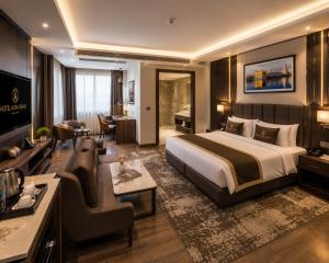 a hotel room with a bed and a living room at the glory stay in Amritsar