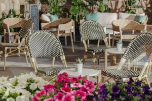 a group of chairs and tables and flowers at La França Hotel Boutique in Barcelona +165 photos