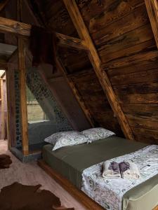a bedroom with a bed in a attic at Astoha in Durrës