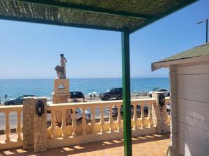 a balcony with a view of the ocean at La Casita del Mar in Torrox