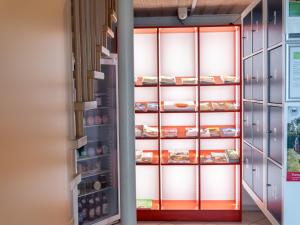 an open door to a refrigerator filled with food at Ferienhof Häckler in Ochsenhausen +40 photos