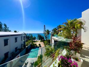 an apartment balcony with a view of the ocean at Breathtaking seaview penthouse - Belle Mare in Post of Flacq