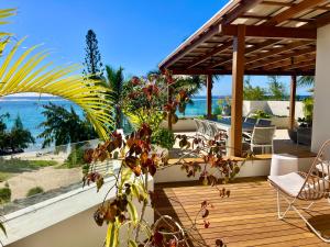 a porch with a view of the beach and the ocean at Breathtaking seaview penthouse - Belle Mare in Post of Flacq
