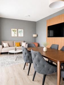 a living room with a table and a couch at Maria Blick in Maria Wörth