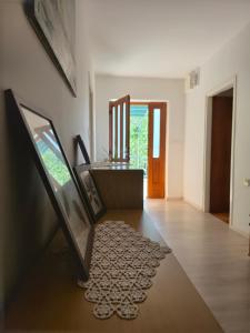 a living room with a table and a mirror at Apartment Rustical in Novalja