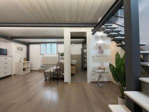 a living room with a staircase and a dining room at Ai Foggiali in Matera