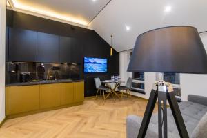 a living room with a couch and a table at MYFREEDOM Premium Apartments near Khreshchatyk in Kyiv