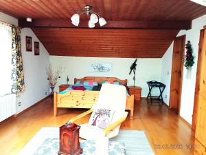 a bedroom with a bed and a couch at Fischer Willi in Bad Koetzting +8 photos