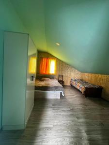 a bedroom with two beds in a room at Barisakho Mountain House in Chirdili